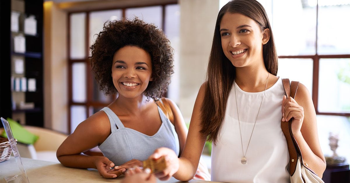 Women checking in for salon and spa appointments